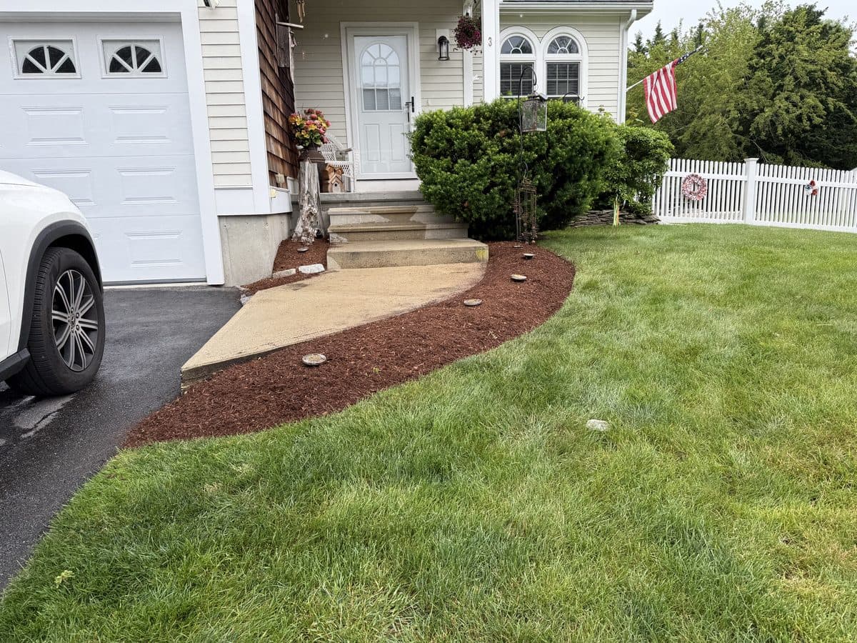 A tidy, well-kept home exterior with a maintained lawn